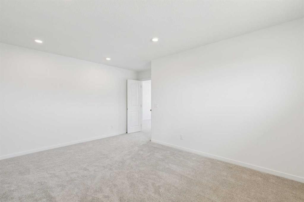 156 Southborough Common, Cochrane, AB - Indoor Photo Showing Other Room