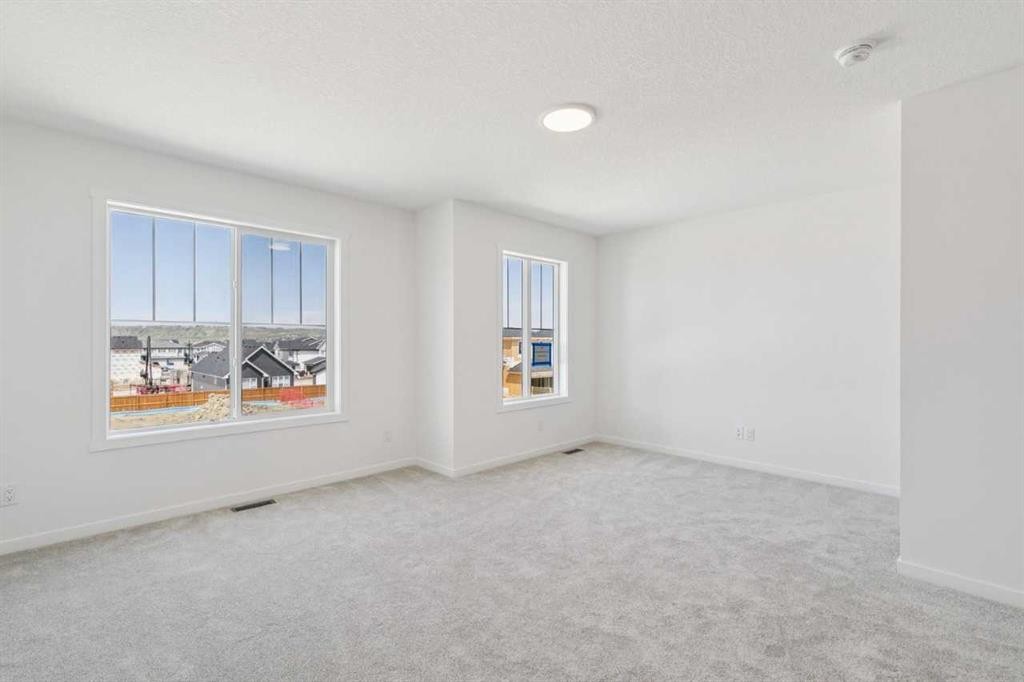 156 Southborough Common, Cochrane, AB - Indoor Photo Showing Other Room