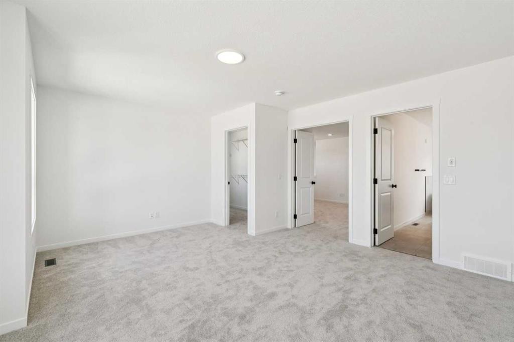 156 Southborough Common, Cochrane, AB - Indoor Photo Showing Other Room