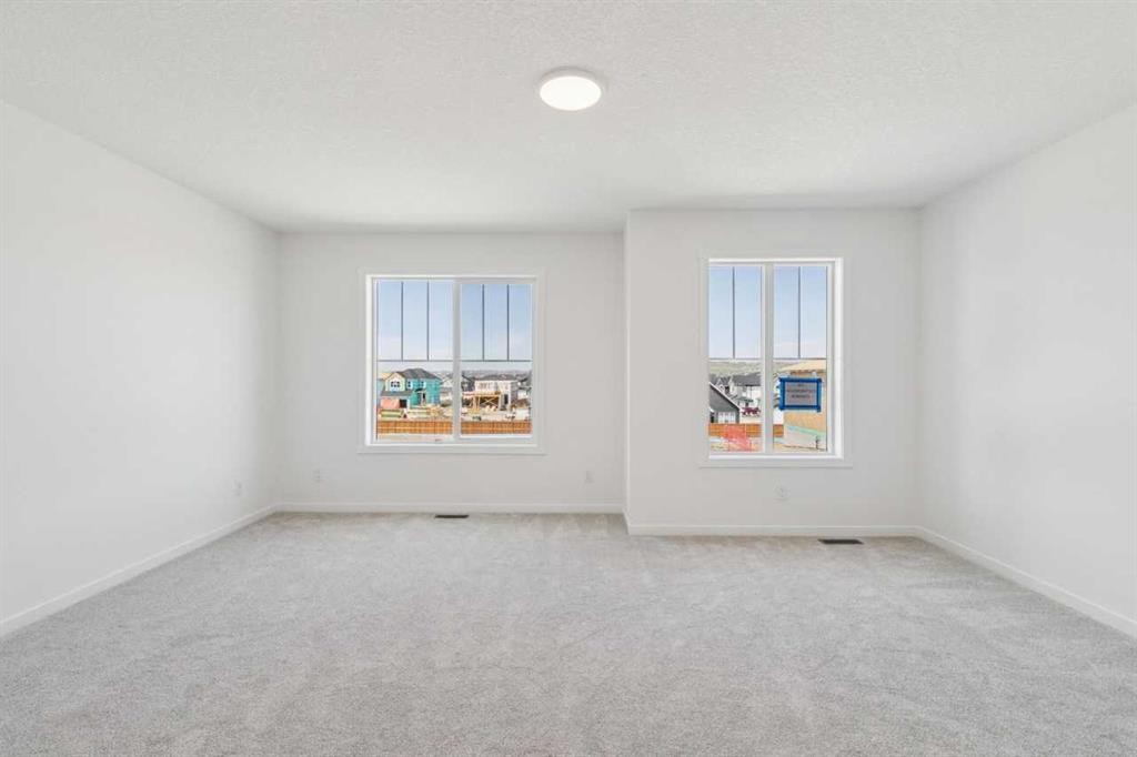 156 Southborough Common, Cochrane, AB - Indoor Photo Showing Other Room