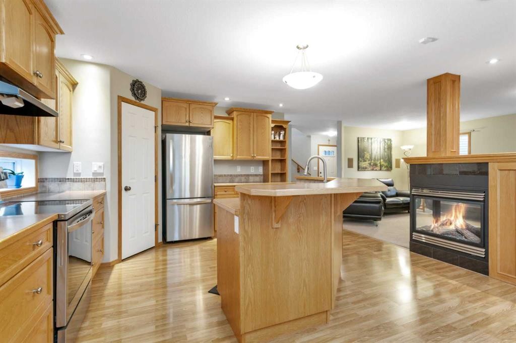35 Lang Close, Red Deer, AB - Indoor Photo Showing Kitchen With Fireplace