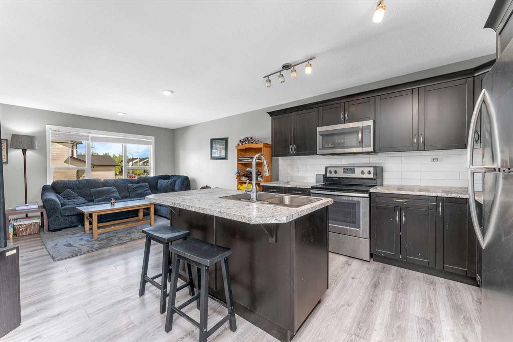 22 Hawthorn Place, Sylvan Lake, AB - Indoor Photo Showing Kitchen With Stainless Steel Kitchen With Double Sink