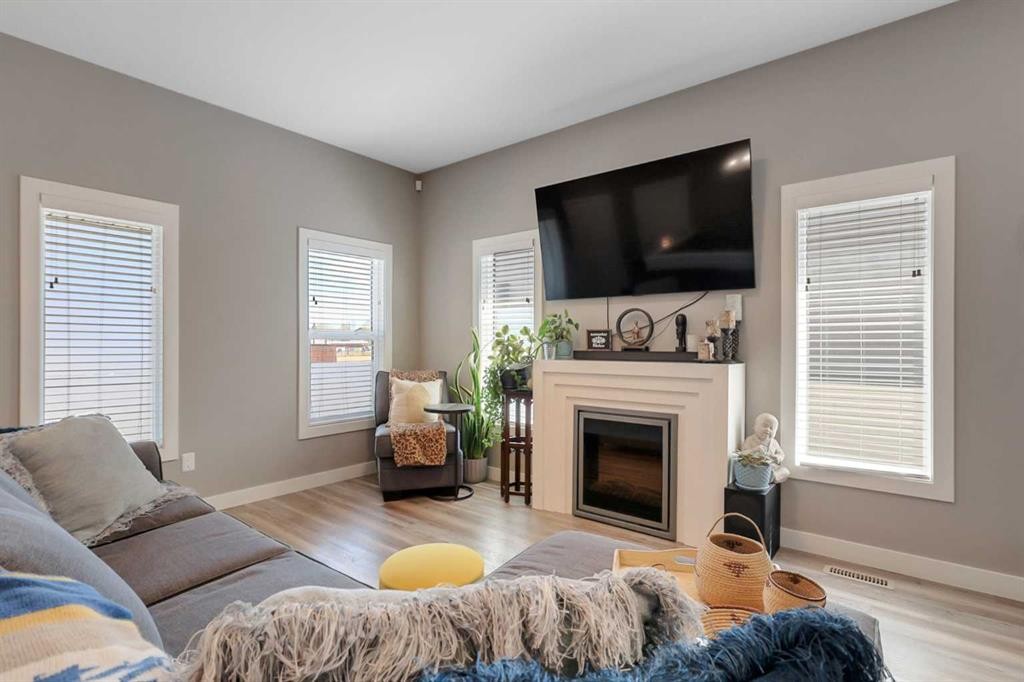 68 Windermere Close, Red Deer, AB - Indoor Photo Showing Living Room With Fireplace