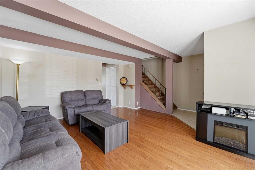 1 Greig Close, Red Deer, AB - Indoor Photo Showing Living Room With Fireplace