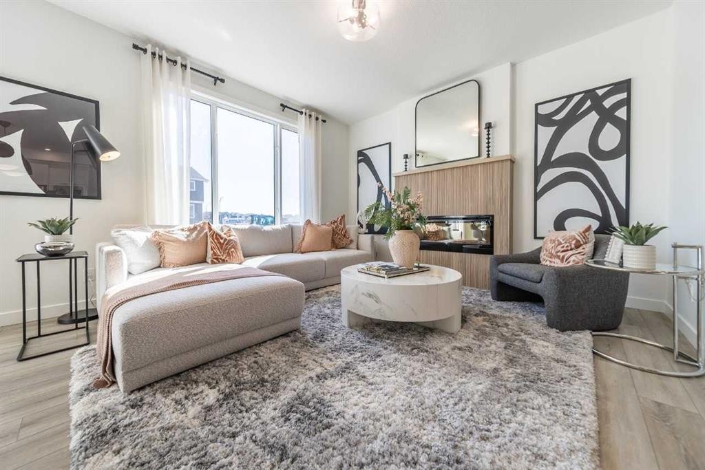 43 Verdure Gate Sw, Calgary, AB - Indoor Photo Showing Living Room With Fireplace