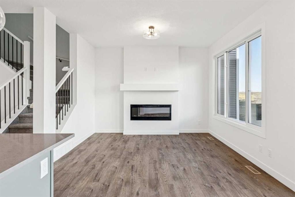 206 Sora Way Se, Calgary, AB - Indoor Photo Showing Living Room With Fireplace