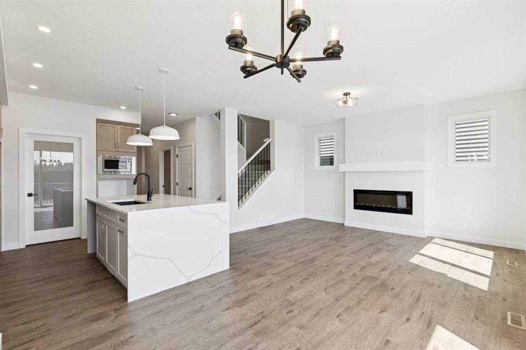 65 Sora Gardens Se, Calgary, AB - Indoor With Fireplace
