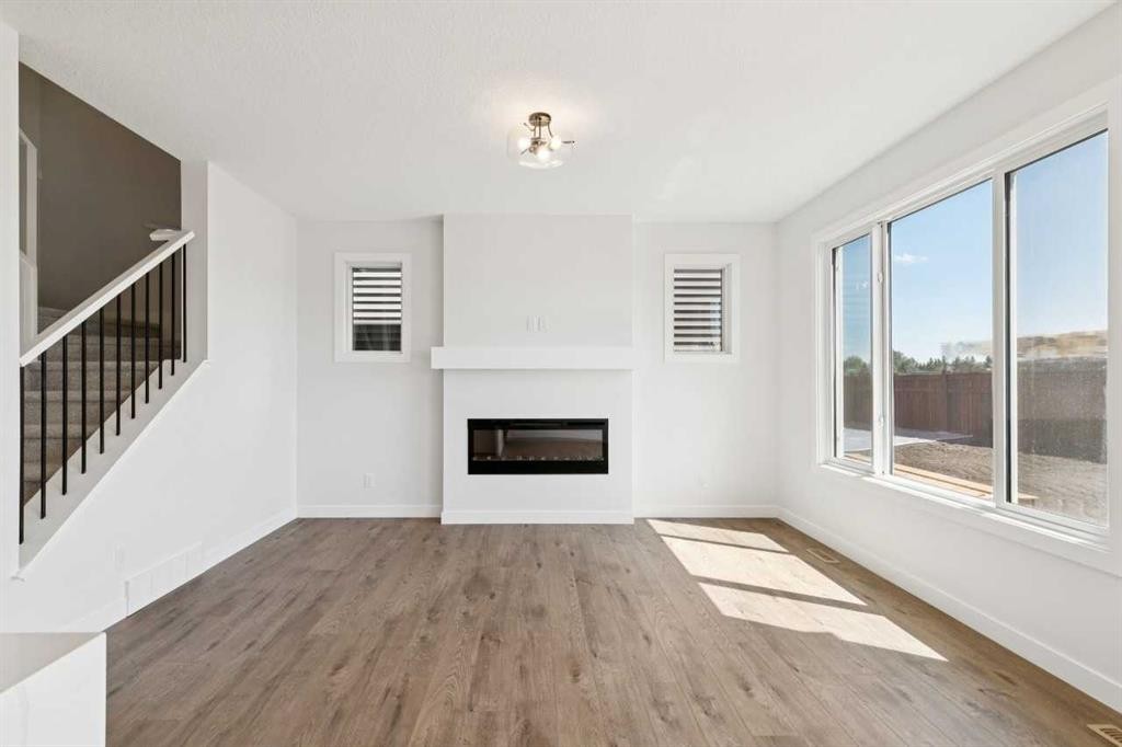 65 Sora Gardens Se, Calgary, AB - Indoor With Fireplace