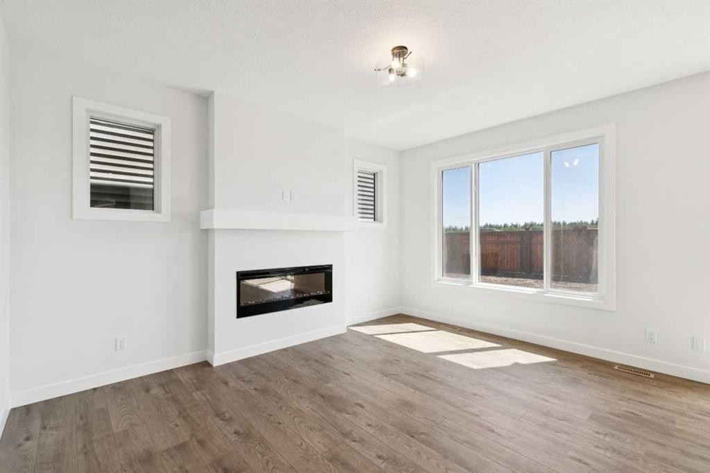 65 Sora Gardens Se, Calgary, AB - Indoor Photo Showing Living Room With Fireplace