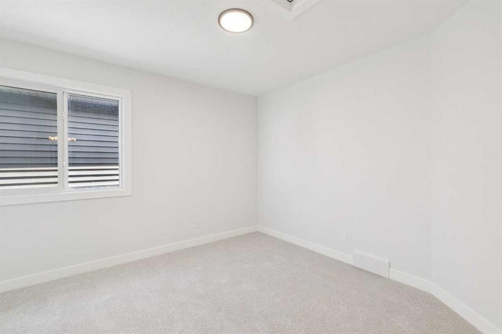65 Sora Gardens Se, Calgary, AB - Indoor Photo Showing Other Room