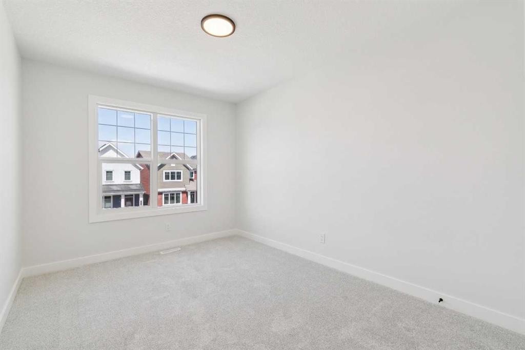 65 Sora Gardens Se, Calgary, AB - Indoor Photo Showing Other Room