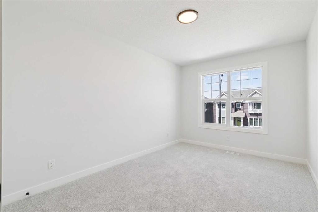 65 Sora Gardens Se, Calgary, AB - Indoor Photo Showing Other Room