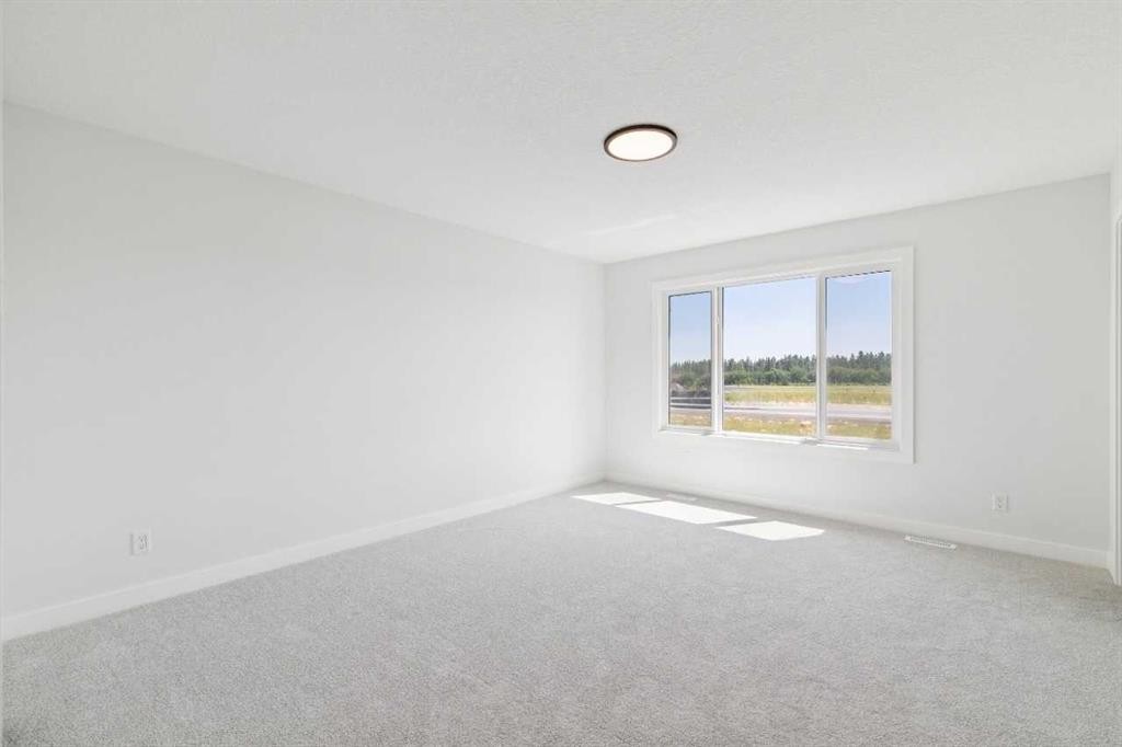 65 Sora Gardens Se, Calgary, AB - Indoor Photo Showing Other Room