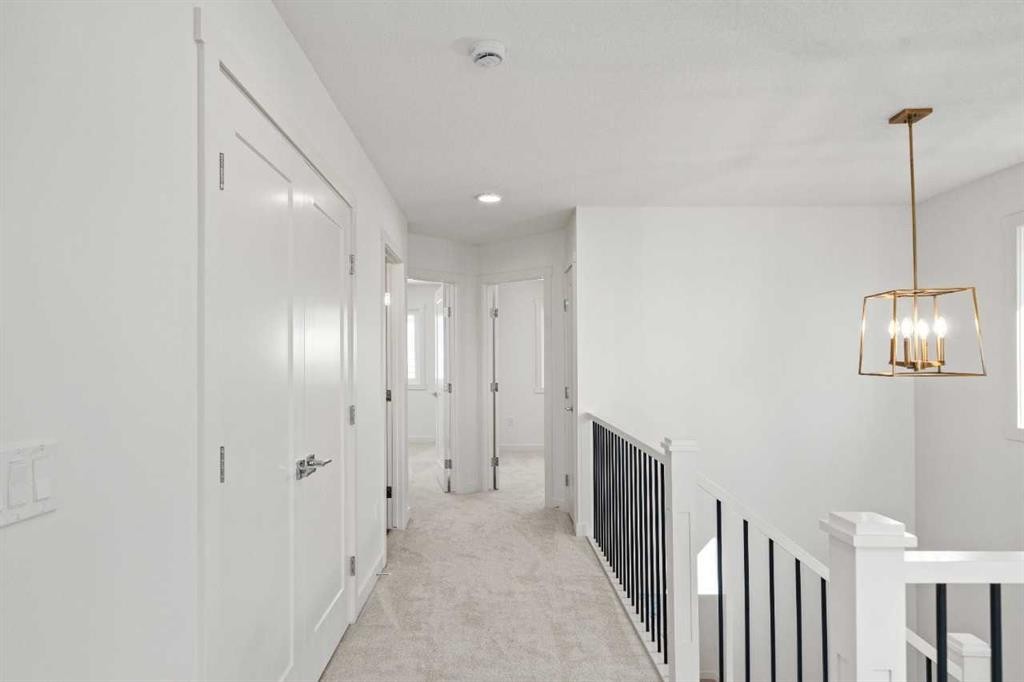 83 Heritage Manor, Cochrane, AB - Indoor Photo Showing Other Room