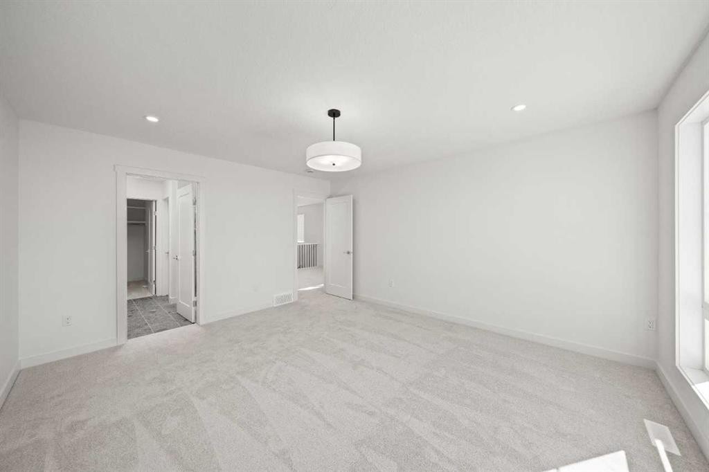 83 Heritage Manor, Cochrane, AB - Indoor Photo Showing Other Room