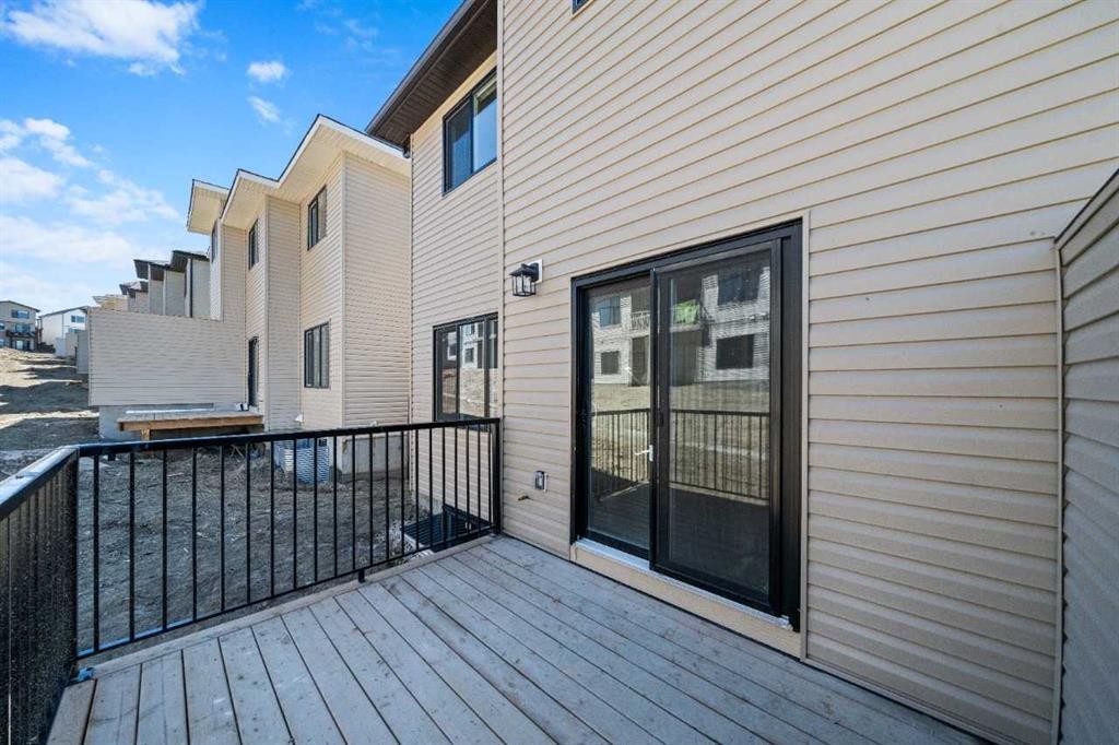 83 Heritage Manor, Cochrane, AB - Outdoor With Exterior