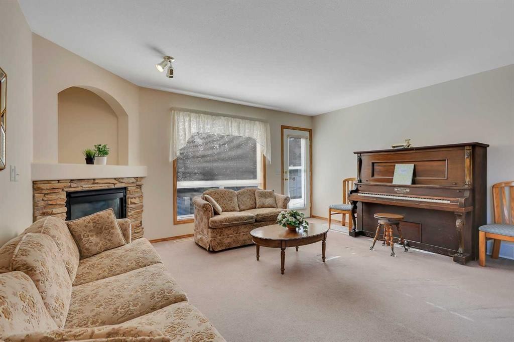 2 Janko Close, Red Deer, AB - Indoor Photo Showing Living Room With Fireplace