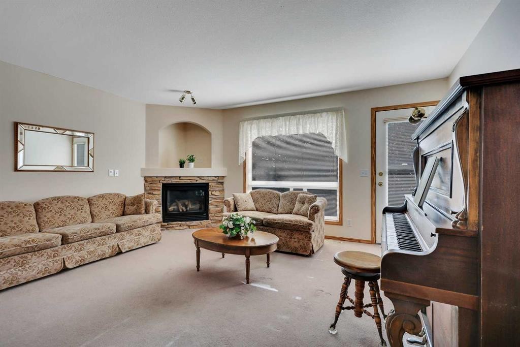 2 Janko Close, Red Deer, AB - Indoor Photo Showing Living Room With Fireplace