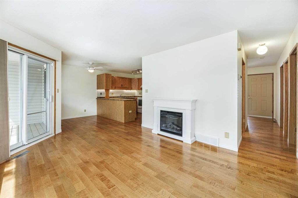 59-2816 Botterill Crescent, Red Deer, AB - Indoor Photo Showing Living Room With Fireplace