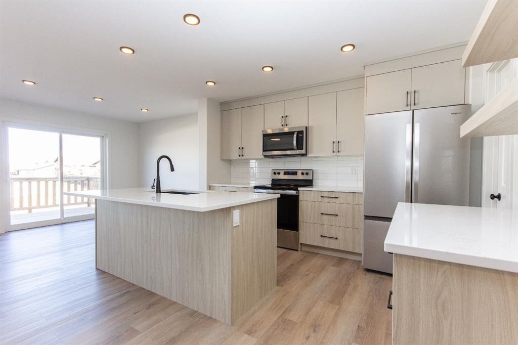 60 Trinity Street, Lacombe, AB - Indoor Photo Showing Kitchen With Stainless Steel Kitchen With Upgraded Kitchen