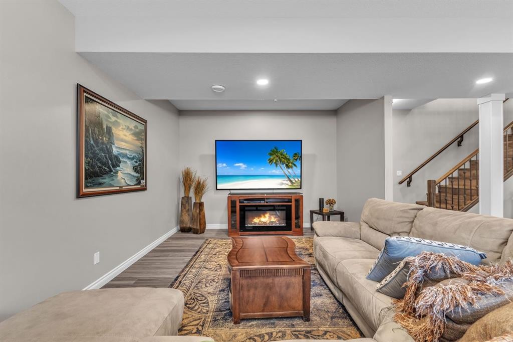 5052 Lakeshore Drive, Sylvan Lake, AB - Indoor Photo Showing Living Room With Fireplace