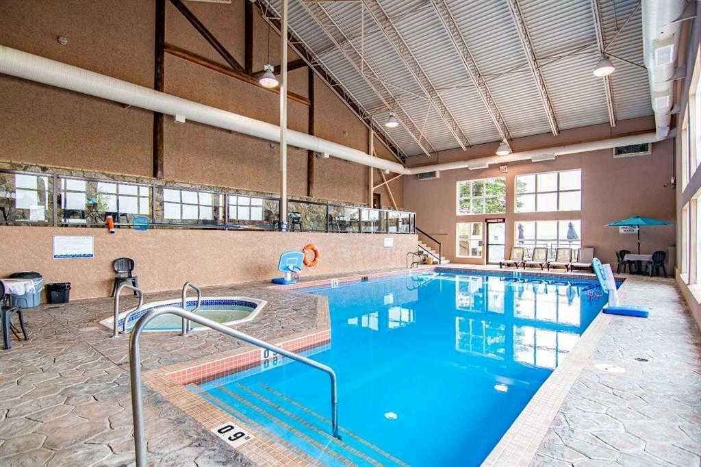 4024-25054 South Pine Lake Road, Rural Red Deer County, AB - Indoor Photo Showing Other Room With In Ground Pool