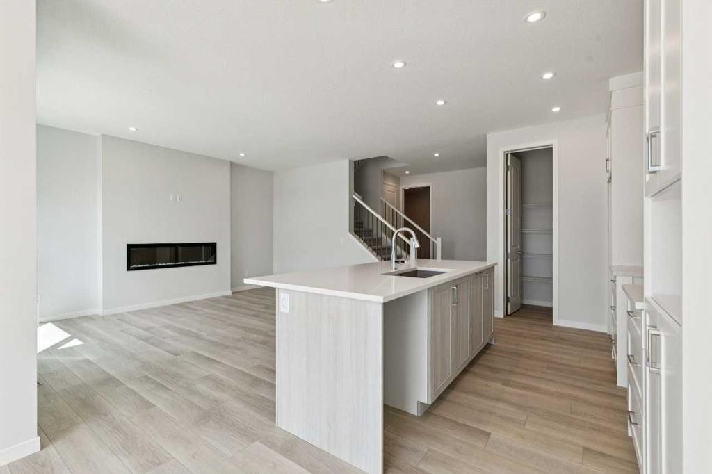 41 Belmont Row Sw, Calgary, AB - Indoor With Fireplace