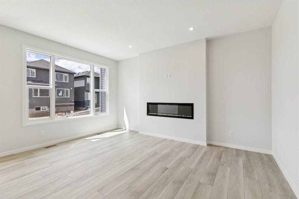 41 Belmont Row Sw, Calgary, AB - Indoor Photo Showing Living Room With Fireplace