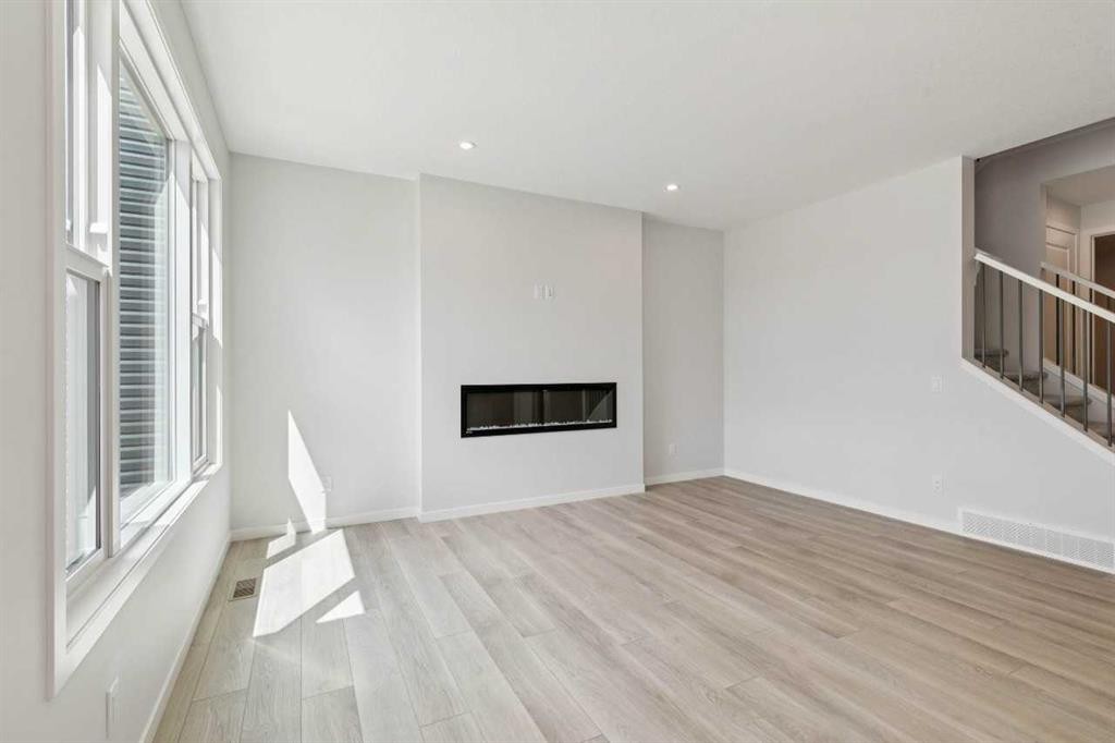 41 Belmont Row Sw, Calgary, AB - Indoor Photo Showing Other Room With Fireplace