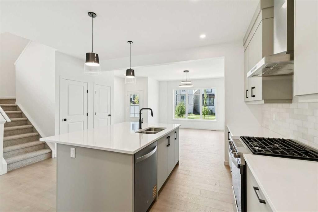 78 Alpine Common Sw, Calgary, AB - Indoor Photo Showing Kitchen With Double Sink With Upgraded Kitchen