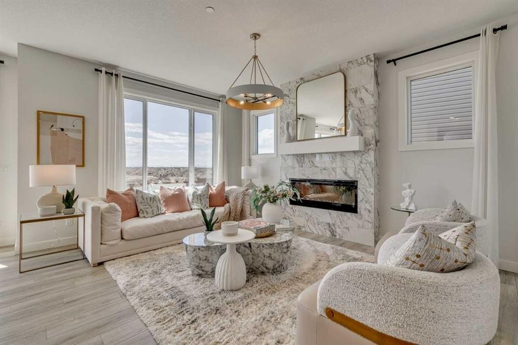 145 Snowberry Common Se, Calgary, AB - Indoor Photo Showing Living Room With Fireplace