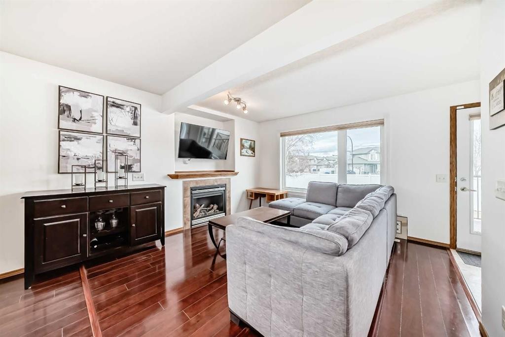102-6220 Orr Drive, Red Deer, AB - Indoor Photo Showing Living Room With Fireplace