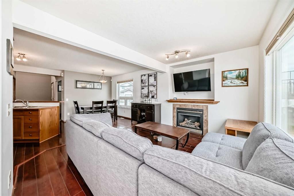 102-6220 Orr Drive, Red Deer, AB - Indoor Photo Showing Living Room With Fireplace