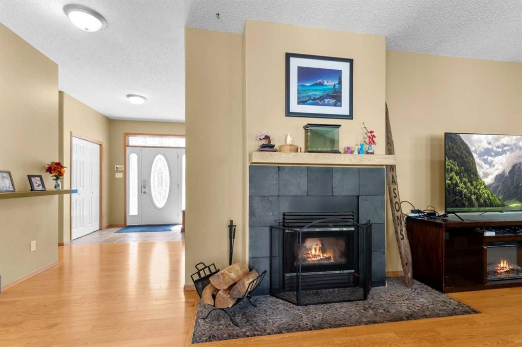 39320-261 Range Road, Rural Lacombe County, AB - Indoor Photo Showing Living Room With Fireplace