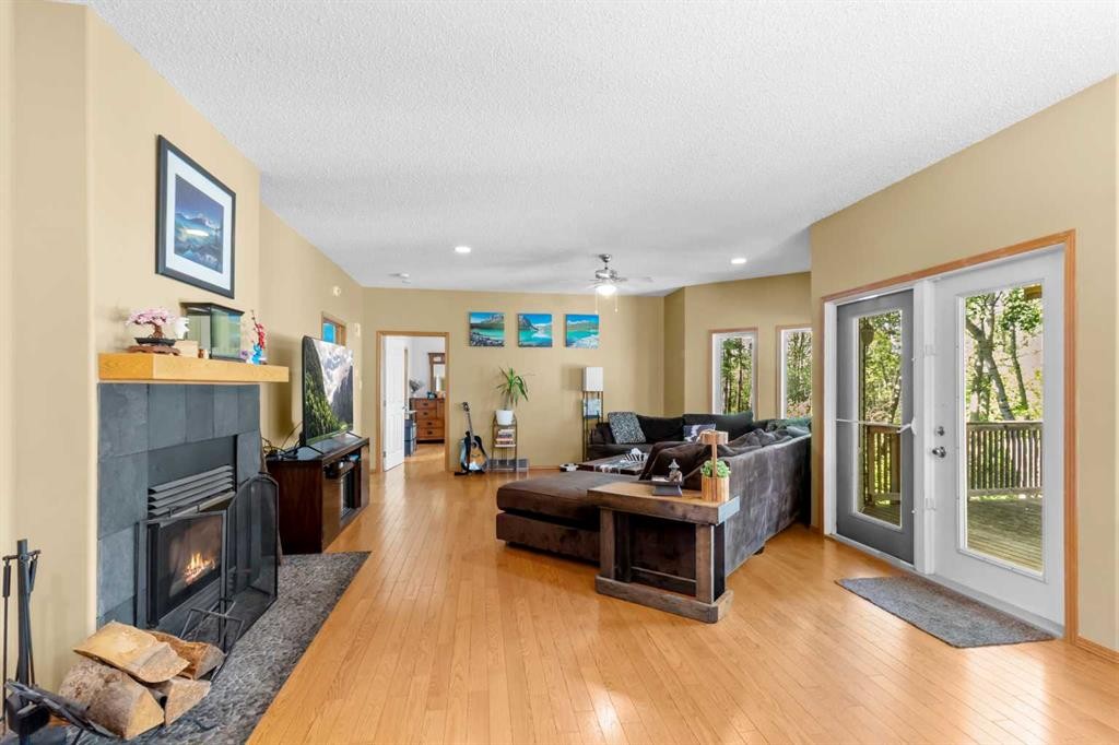 39320-261 Range Road, Rural Lacombe County, AB - Indoor Photo Showing Living Room With Fireplace