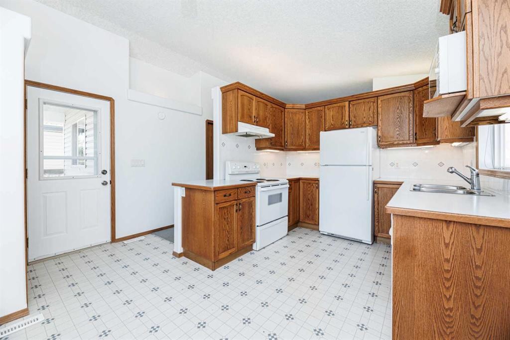 13 Duval Crescent, Red Deer, AB - Indoor Photo Showing Kitchen With Double Sink