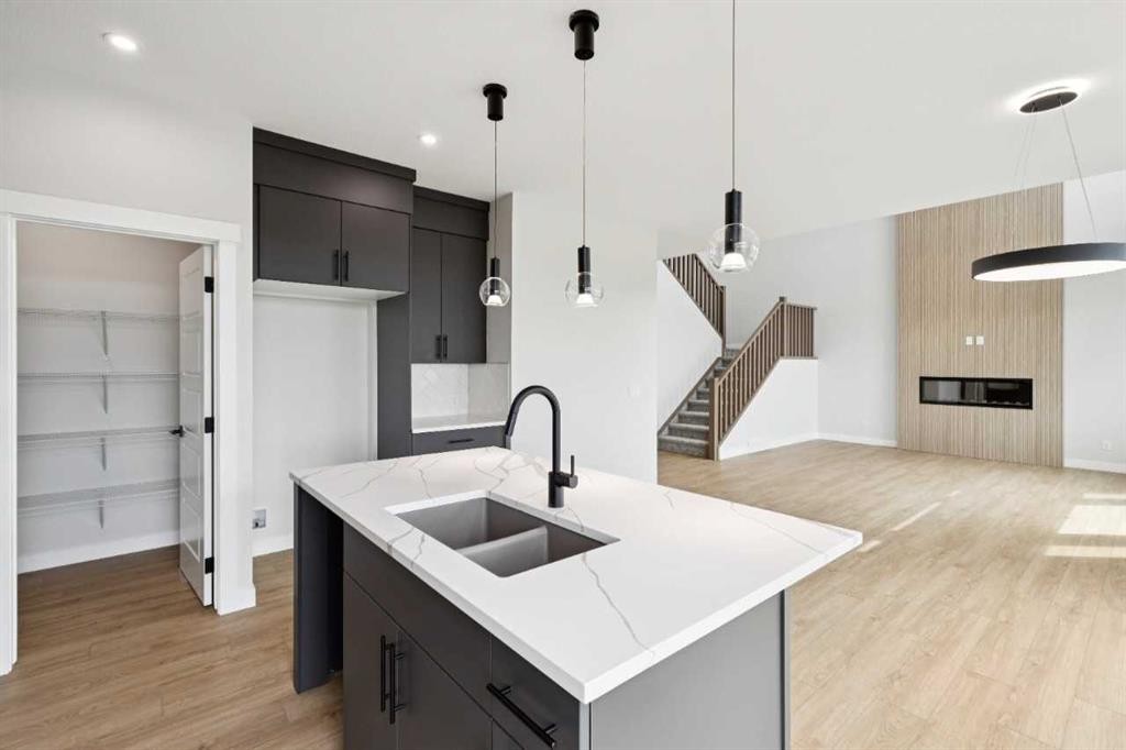 102 Bridgeport Landing, Chestermere, AB - Indoor Photo Showing Kitchen With Double Sink With Upgraded Kitchen