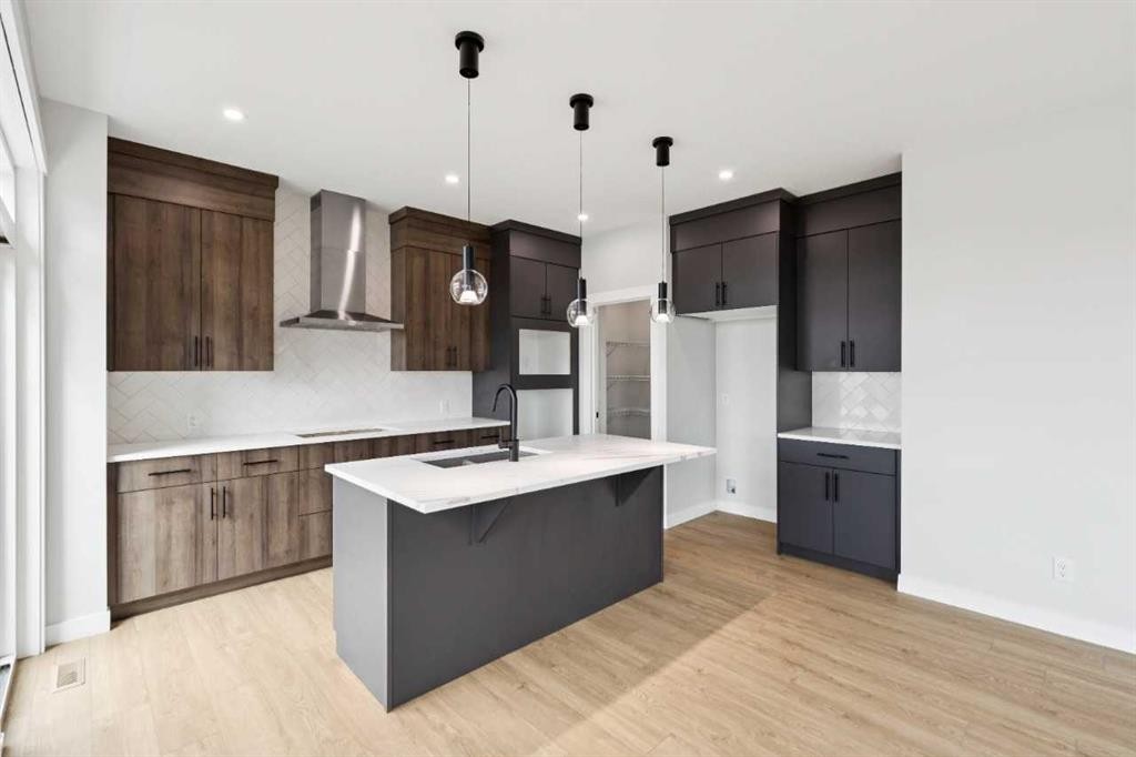 102 Bridgeport Landing, Chestermere, AB - Indoor Photo Showing Kitchen With Upgraded Kitchen