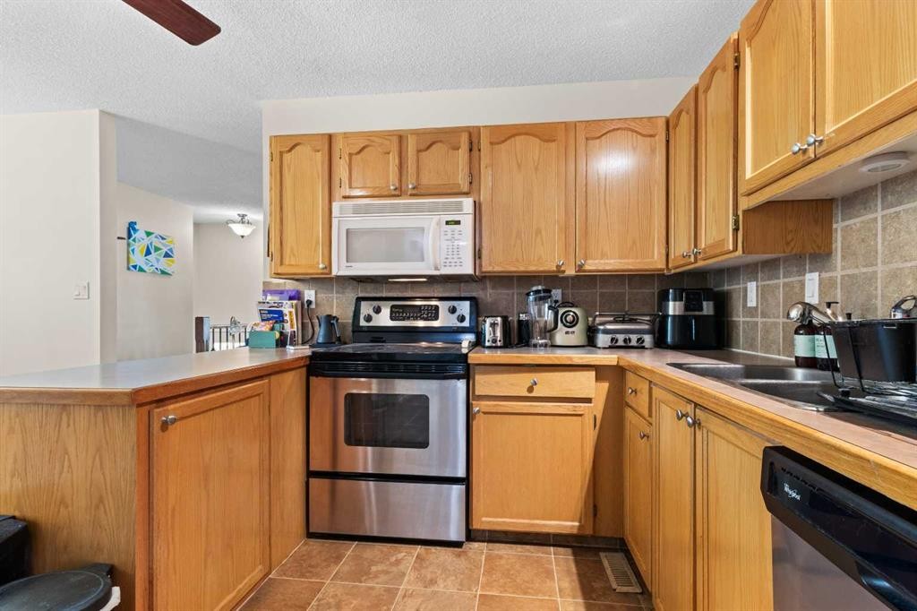 5 Mccullough Crescent, Red Deer, AB - Indoor Photo Showing Kitchen With Double Sink