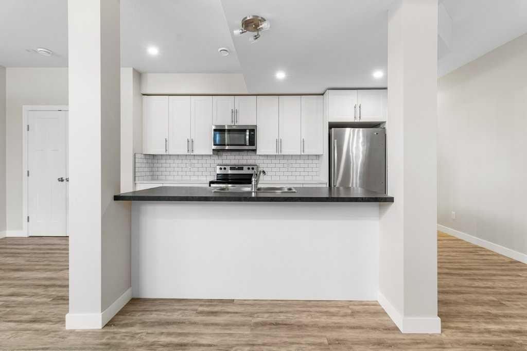 3902 46 Street, Red Deer, AB - Indoor Photo Showing Kitchen With Double Sink