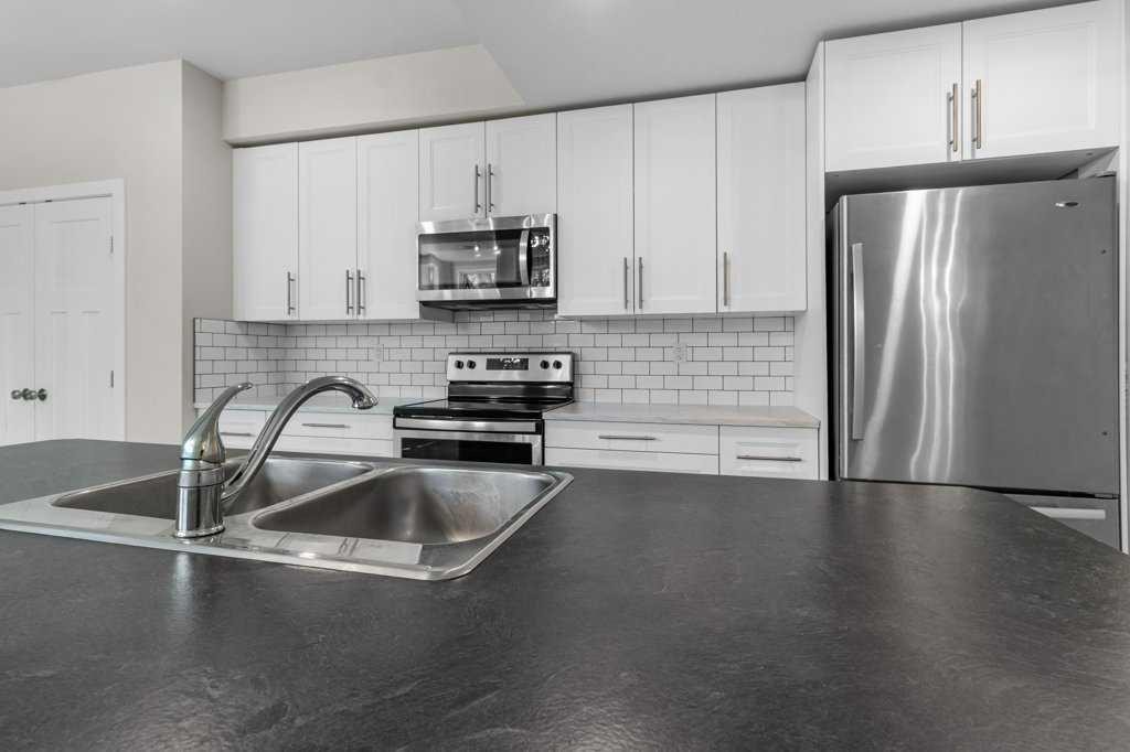 3902 46 Street, Red Deer, AB - Indoor Photo Showing Kitchen With Double Sink With Upgraded Kitchen