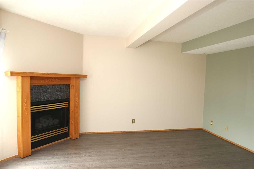 9 Greig Close, Red Deer, AB - Indoor Photo Showing Other Room With Fireplace