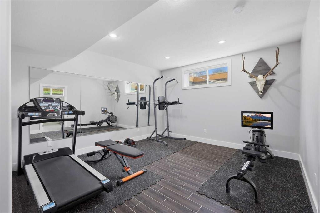 13 Hendrickson Bay, Sylvan Lake, AB - Indoor Photo Showing Gym Room