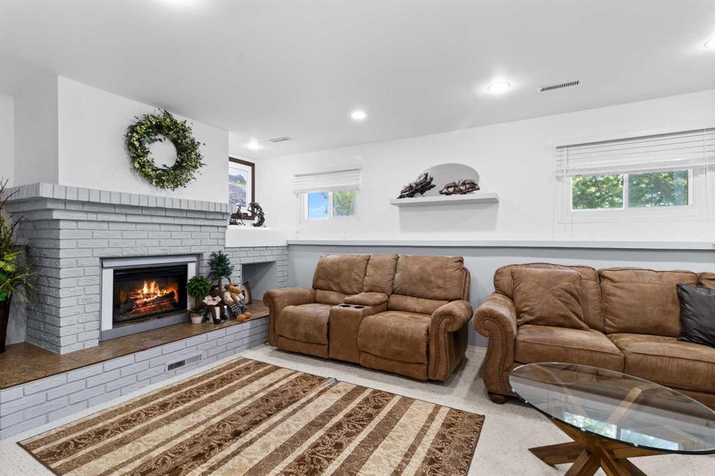 45 Sylvan Drive, Sylvan Lake, AB - Indoor Photo Showing Living Room With Fireplace