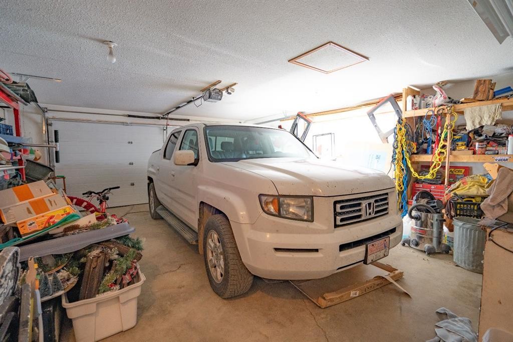 4908 47 Street, Clive, AB - Indoor Photo Showing Garage