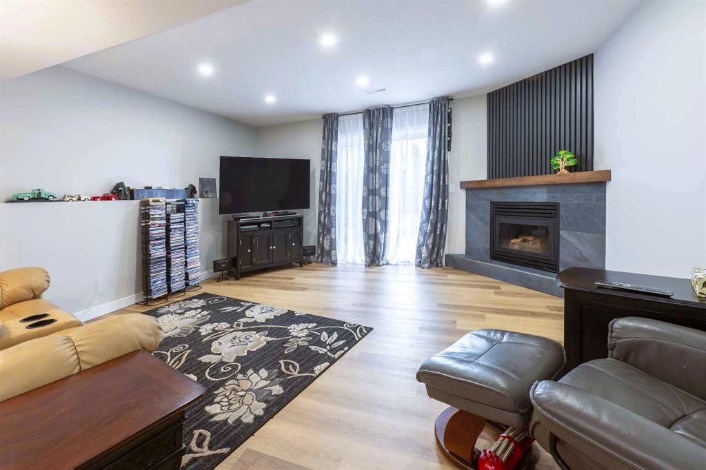 19 Royal Crescent, Lacombe, AB - Indoor With Fireplace