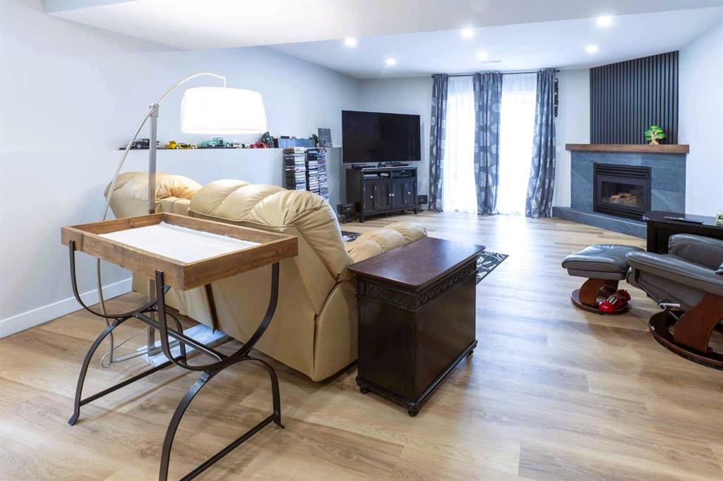 19 Royal Crescent, Lacombe, AB - Indoor With Fireplace