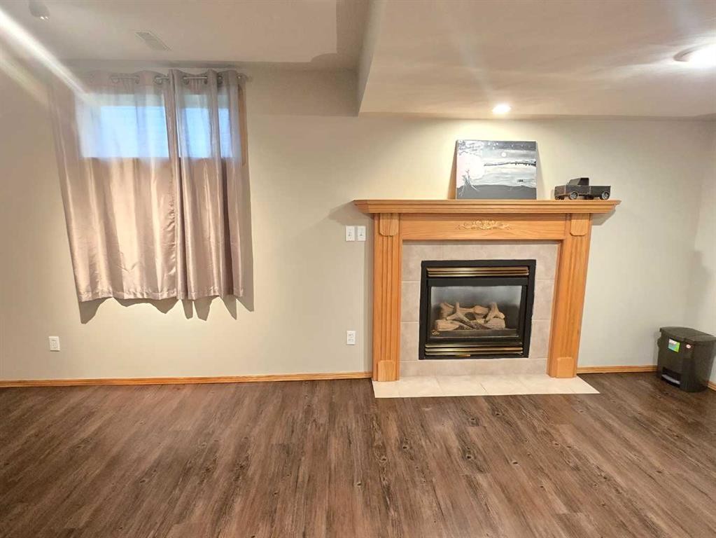 12 Archibald Crescent, Red Deer, AB - Indoor Photo Showing Living Room With Fireplace