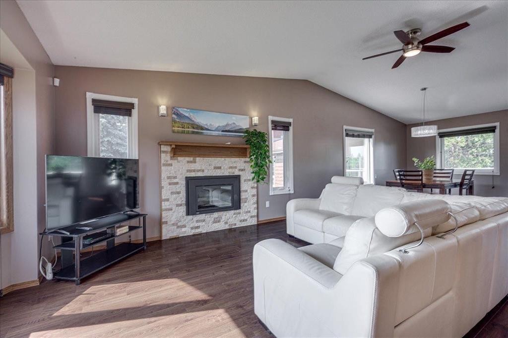 3908 39 Street Close, Ponoka, AB - Indoor Photo Showing Living Room With Fireplace