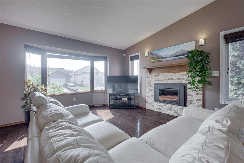 3908 39 Street Close, Ponoka, AB - Indoor Photo Showing Living Room With Fireplace